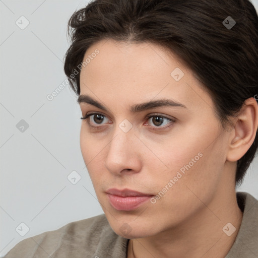 Neutral white young-adult female with short  brown hair and brown eyes