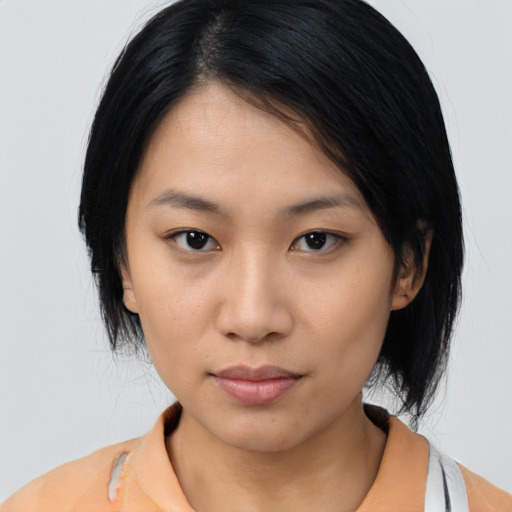 Neutral asian young-adult female with medium  black hair and brown eyes