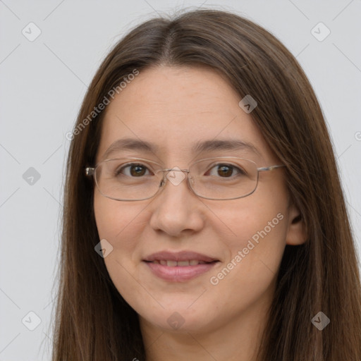 Joyful white adult female with long  brown hair and brown eyes