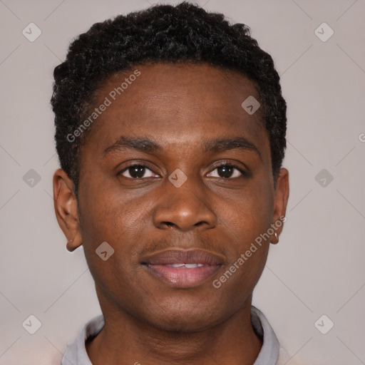 Joyful black young-adult male with short  brown hair and brown eyes