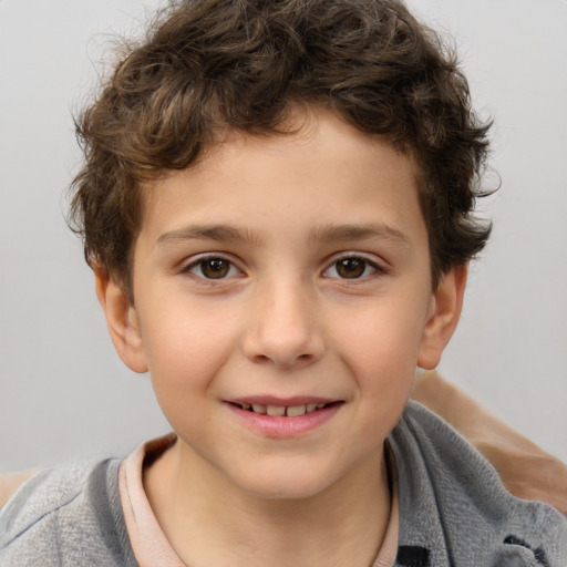 Joyful white child male with short  brown hair and brown eyes