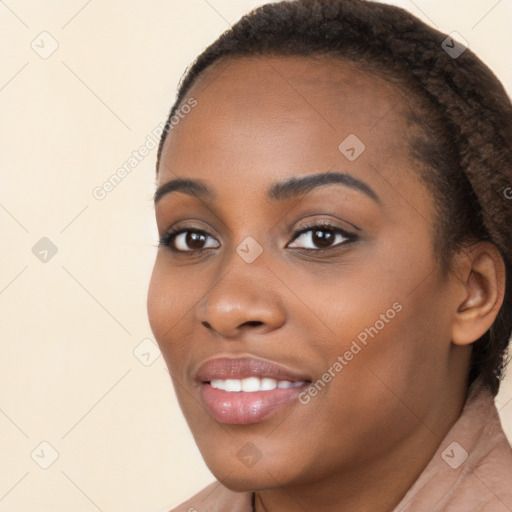 Joyful black young-adult female with long  brown hair and brown eyes