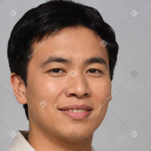 Joyful asian young-adult male with short  brown hair and brown eyes