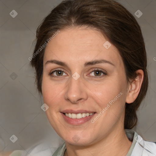 Joyful white adult female with medium  brown hair and green eyes