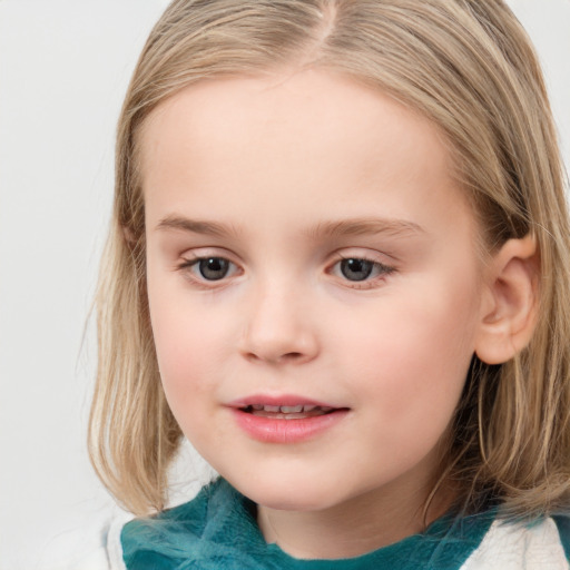 Joyful white child female with medium  brown hair and blue eyes