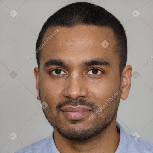 Neutral black young-adult male with short  black hair and brown eyes