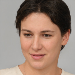 Joyful white young-adult female with medium  brown hair and brown eyes