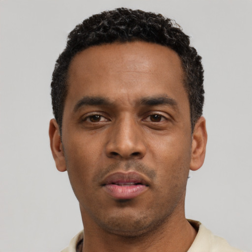 Neutral black young-adult male with short  black hair and brown eyes