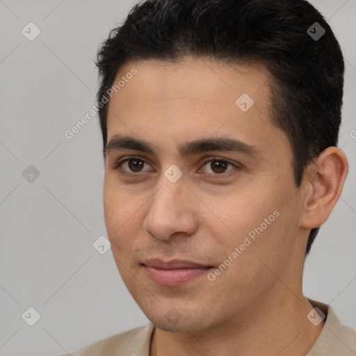 Joyful white young-adult male with short  brown hair and brown eyes