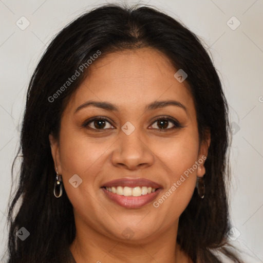 Joyful latino young-adult female with long  brown hair and brown eyes