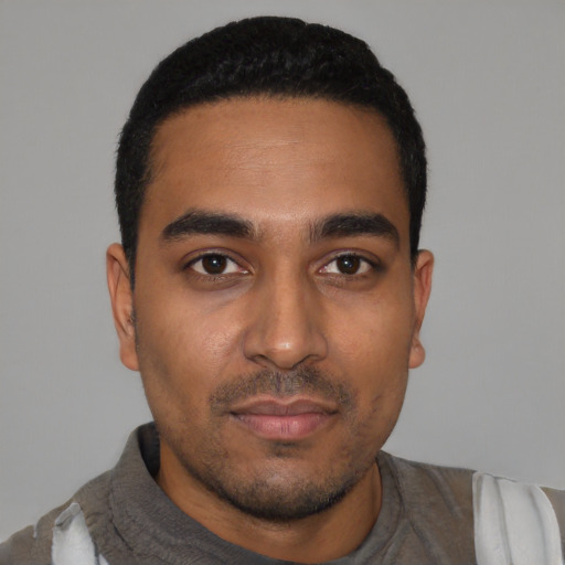 Neutral latino young-adult male with short  black hair and brown eyes