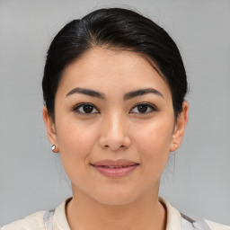 Joyful asian young-adult female with medium  brown hair and brown eyes