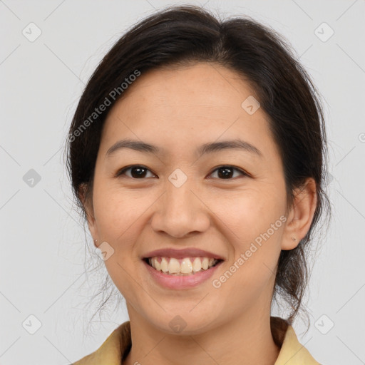 Joyful white young-adult female with medium  brown hair and brown eyes