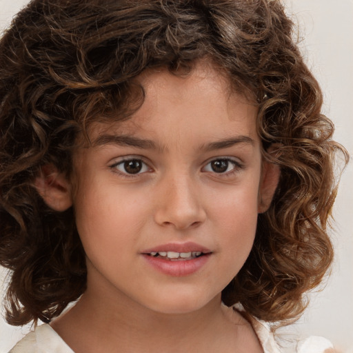 Joyful white child female with medium  brown hair and brown eyes