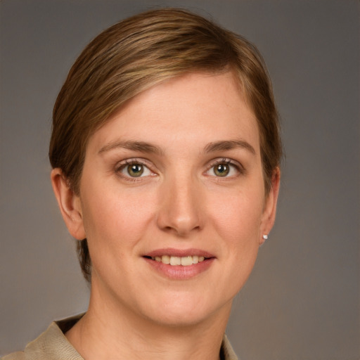 Joyful white young-adult female with short  brown hair and grey eyes