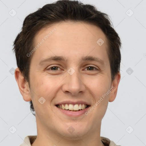 Joyful white adult male with short  brown hair and brown eyes