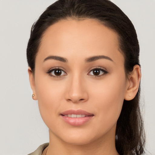 Joyful white young-adult female with medium  brown hair and brown eyes