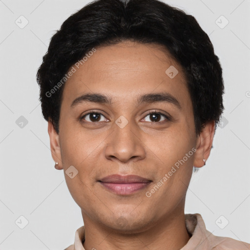 Joyful latino young-adult male with short  black hair and brown eyes