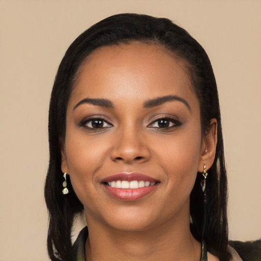 Joyful latino young-adult female with long  black hair and brown eyes