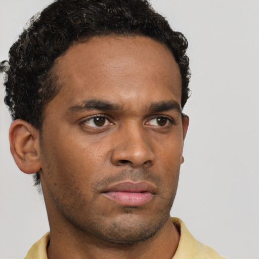 Neutral black young-adult male with short  brown hair and brown eyes