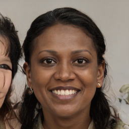 Joyful white adult female with long  brown hair and brown eyes