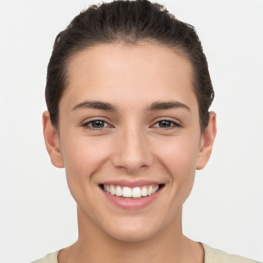 Joyful white young-adult female with short  brown hair and brown eyes