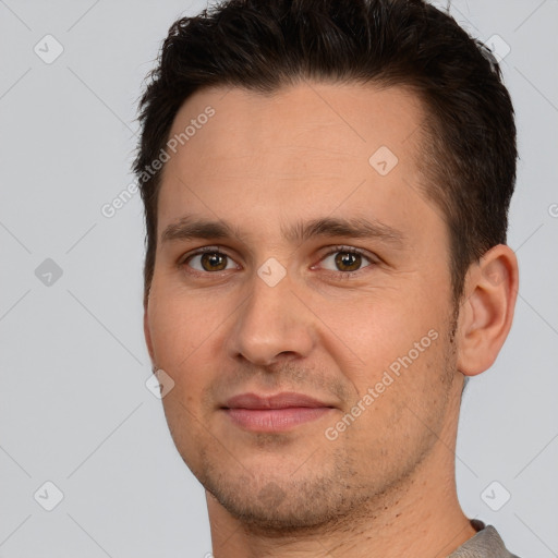 Joyful white young-adult male with short  brown hair and brown eyes