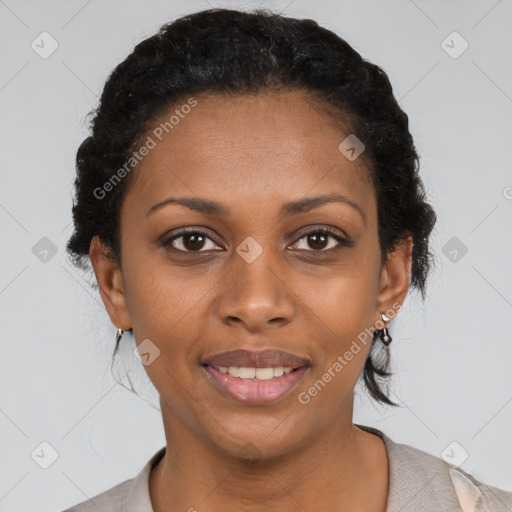 Joyful black adult female with short  brown hair and brown eyes