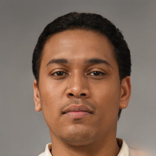 Neutral latino young-adult male with short  brown hair and brown eyes