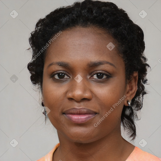 Joyful black young-adult female with medium  black hair and brown eyes