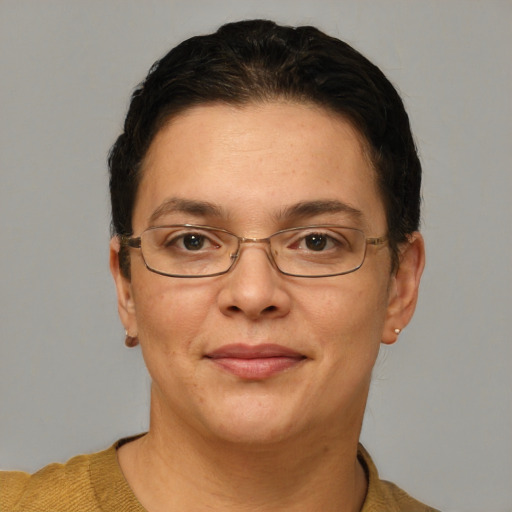 Joyful white adult female with short  brown hair and grey eyes