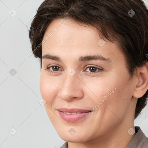 Joyful white young-adult female with short  brown hair and brown eyes