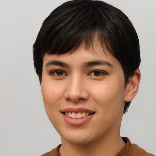 Joyful asian young-adult female with short  brown hair and brown eyes