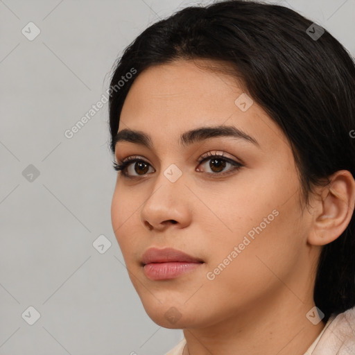 Joyful latino young-adult female with short  black hair and brown eyes