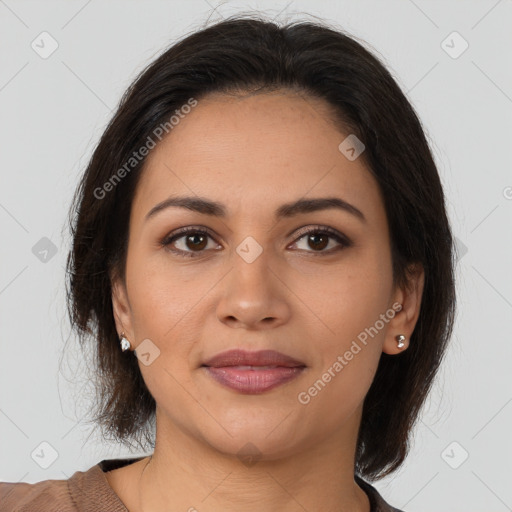 Joyful latino young-adult female with medium  brown hair and brown eyes