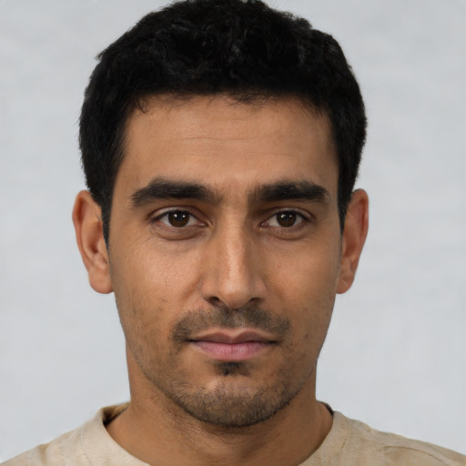 Neutral latino young-adult male with short  black hair and brown eyes
