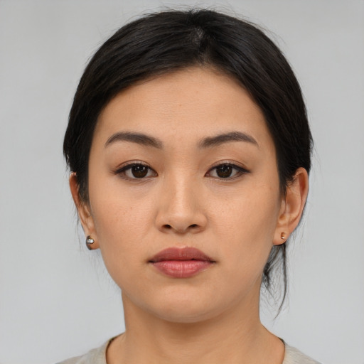 Neutral asian young-adult female with medium  black hair and brown eyes
