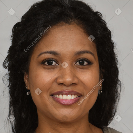 Joyful black young-adult female with long  brown hair and brown eyes