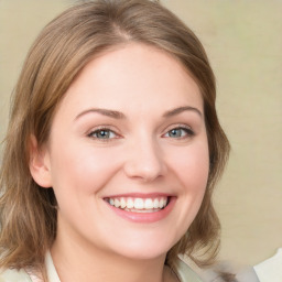 Joyful white young-adult female with medium  brown hair and blue eyes