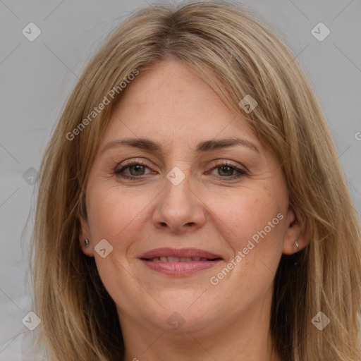 Joyful white adult female with long  brown hair and brown eyes