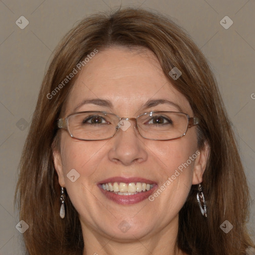 Joyful white adult female with medium  brown hair and blue eyes