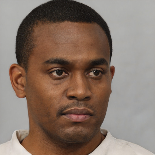 Neutral black young-adult male with short  brown hair and brown eyes