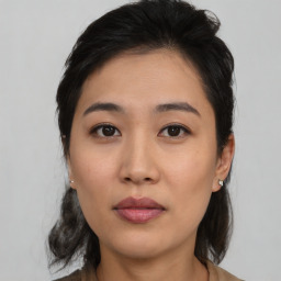 Neutral asian young-adult female with medium  brown hair and brown eyes