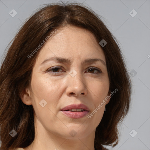 Joyful white adult female with medium  brown hair and brown eyes