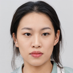 Neutral asian young-adult female with medium  black hair and brown eyes