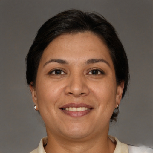 Joyful white adult female with short  brown hair and brown eyes