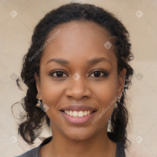 Joyful black young-adult female with long  brown hair and brown eyes