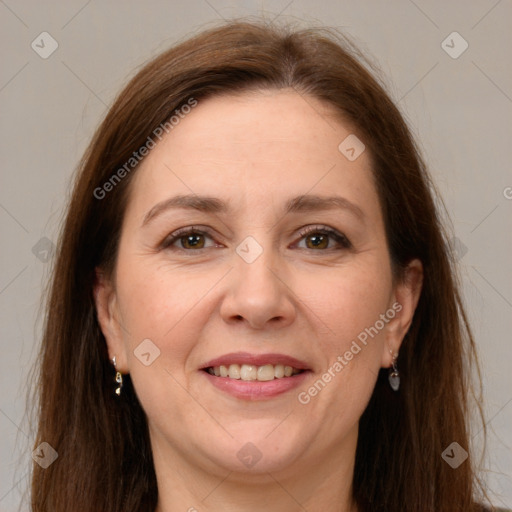 Joyful white adult female with long  brown hair and brown eyes