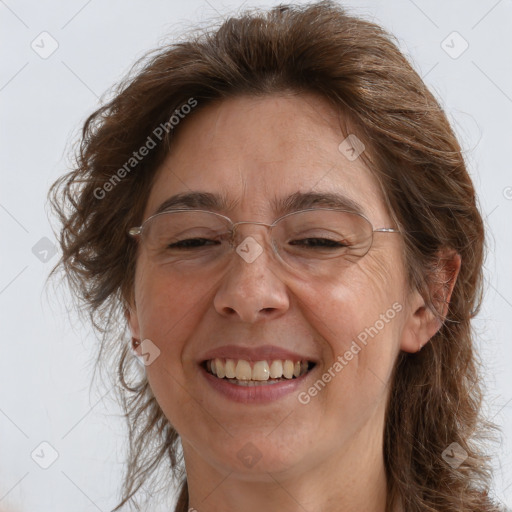 Joyful white adult female with long  brown hair and brown eyes