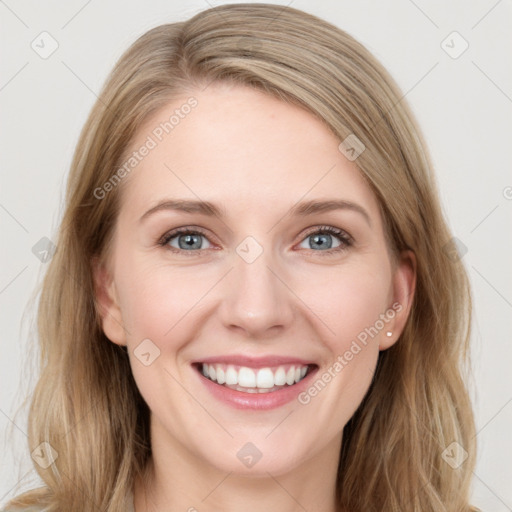 Joyful white young-adult female with long  brown hair and blue eyes